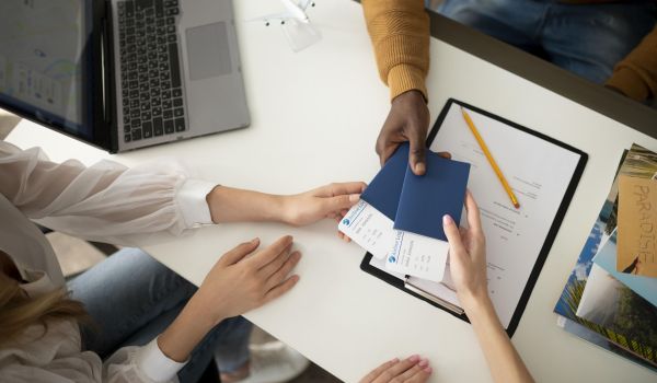 close-up-hands-holding-tickets