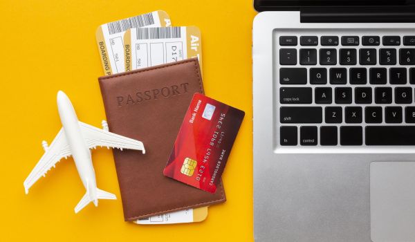 top-view-passport-laptop-arrangement